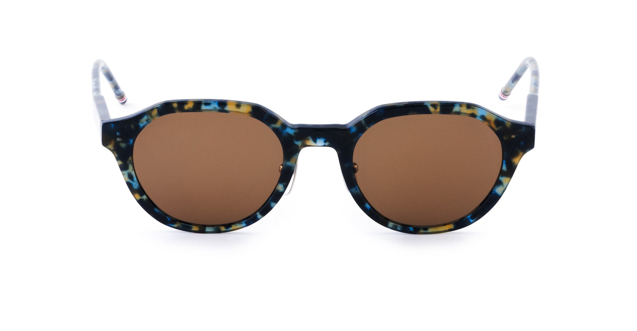 Shield-shaped Thom Browne Sunglasses with brown lenses and a multicolored tortoiseshell frame, featuring blue, yellow, and black speckles.
