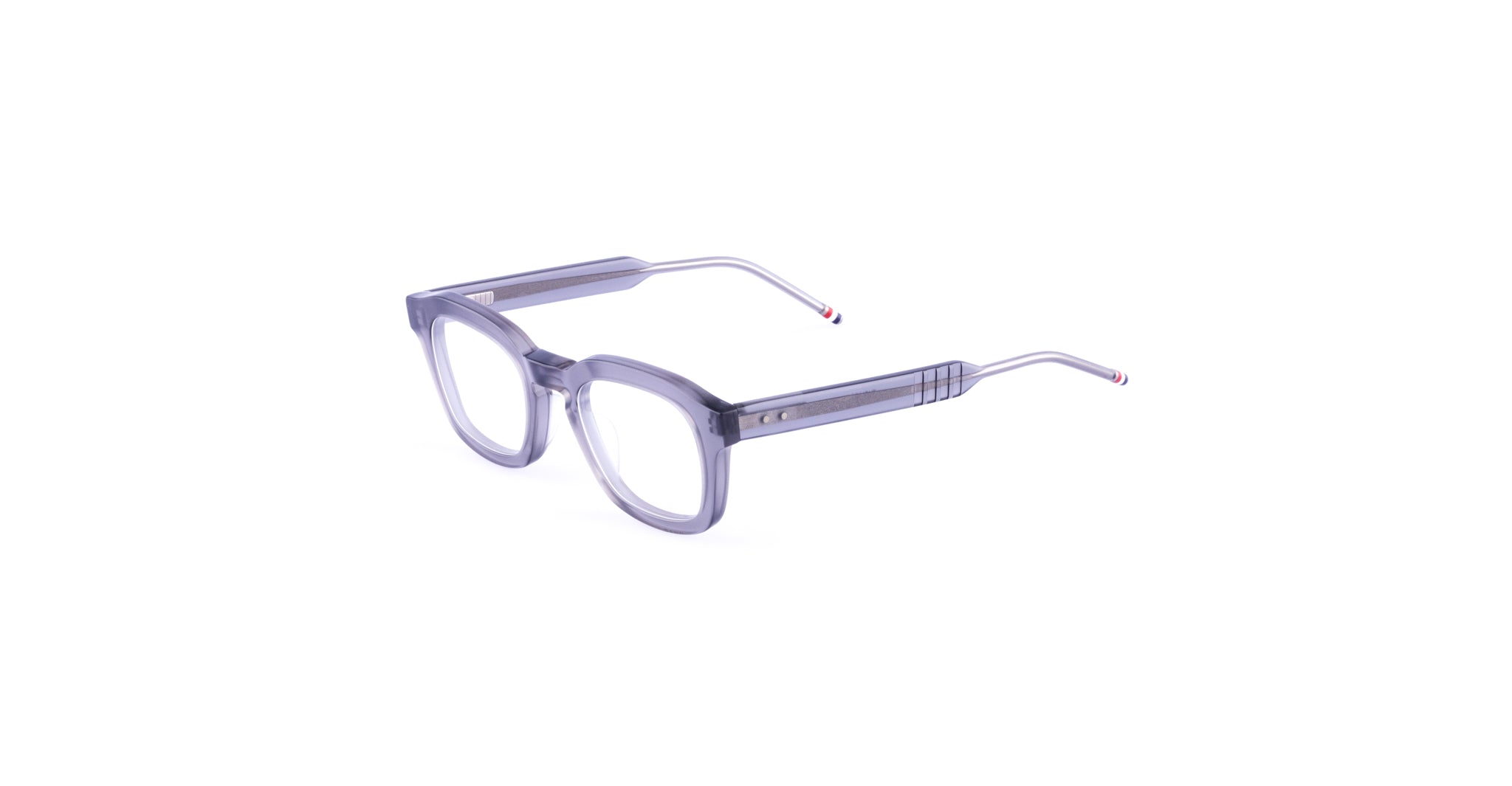 A pair of Thom Browne 412 eyeglasses with clear, rectangular lenses, thick translucent gray frames, and slim metal arms, displayed on a white background.