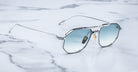 Angled view of the Jacques Marie Mage Bandit style sunglasses in colorway Arcade