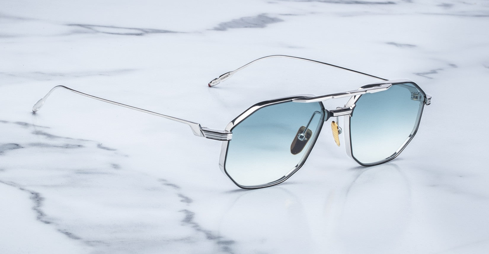 Angled view of the Jacques Marie Mage Bandit style sunglasses in colorway Arcade