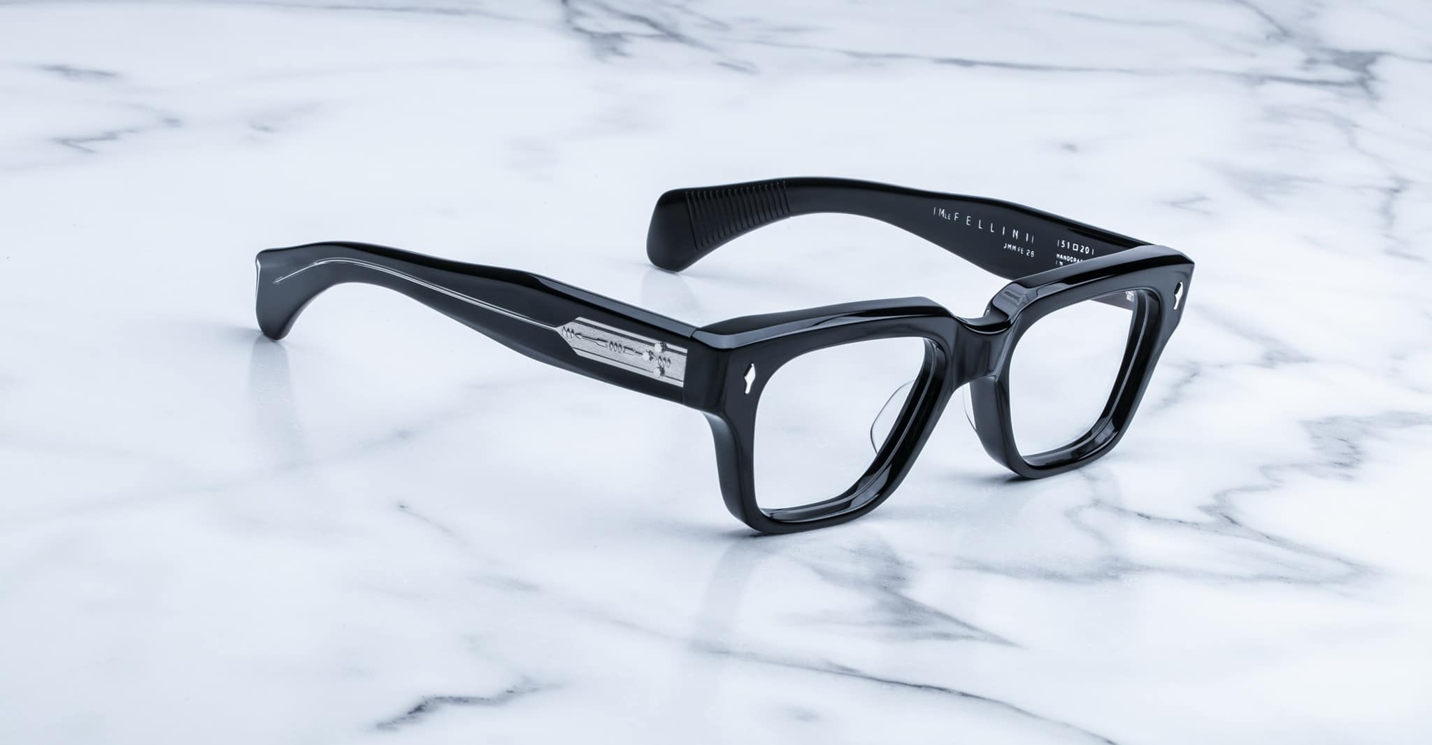 Jacques Marie Mage Fellini black rectangular eyeglasses with thick frames, front view.