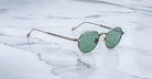 Angled view of the Jacques Marie Mage Fontana style sunglasses in colorway Gold Antique