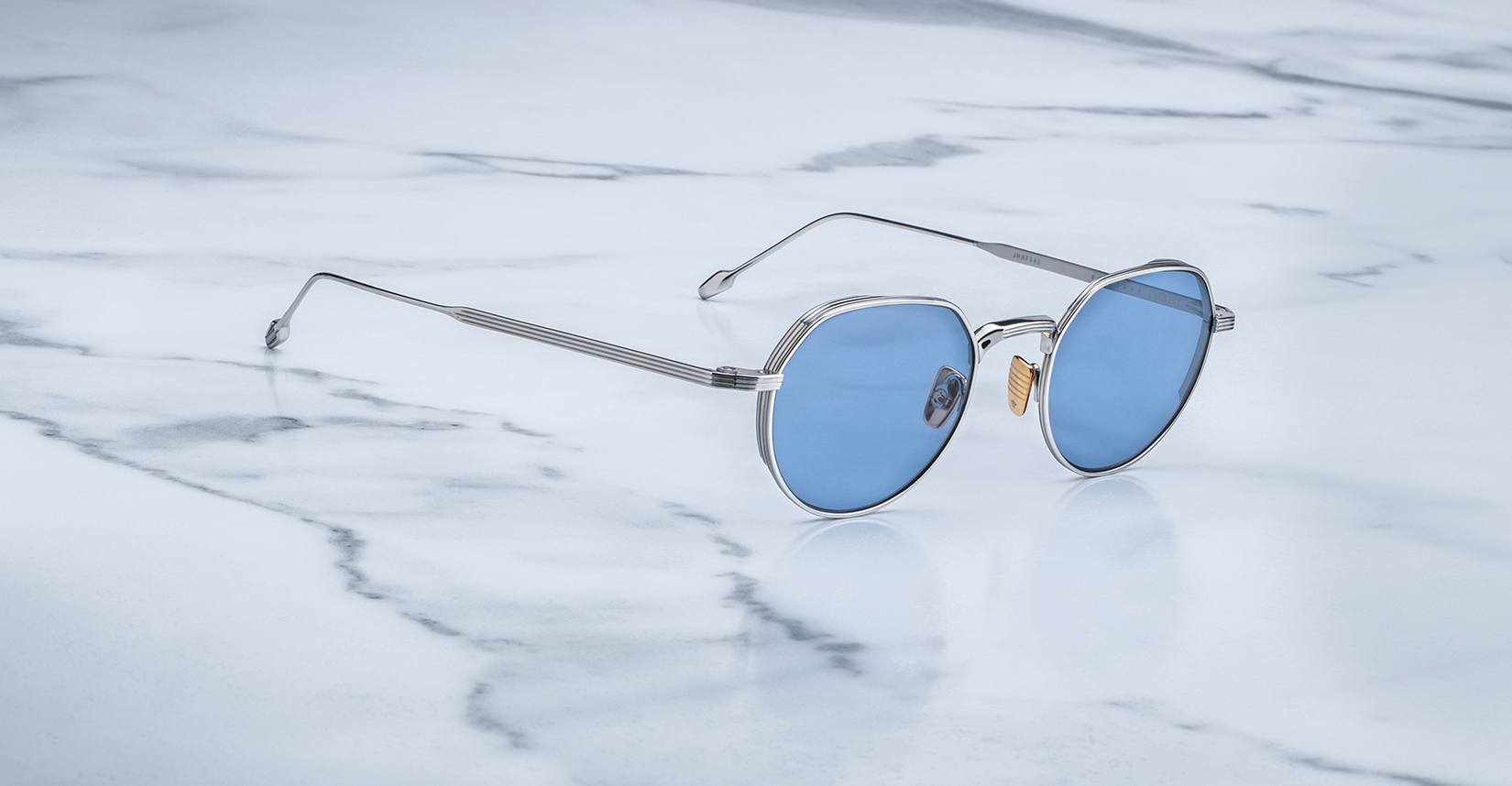 Angled view of the Jacques Marie Mage Fontana style sunglasses in silver