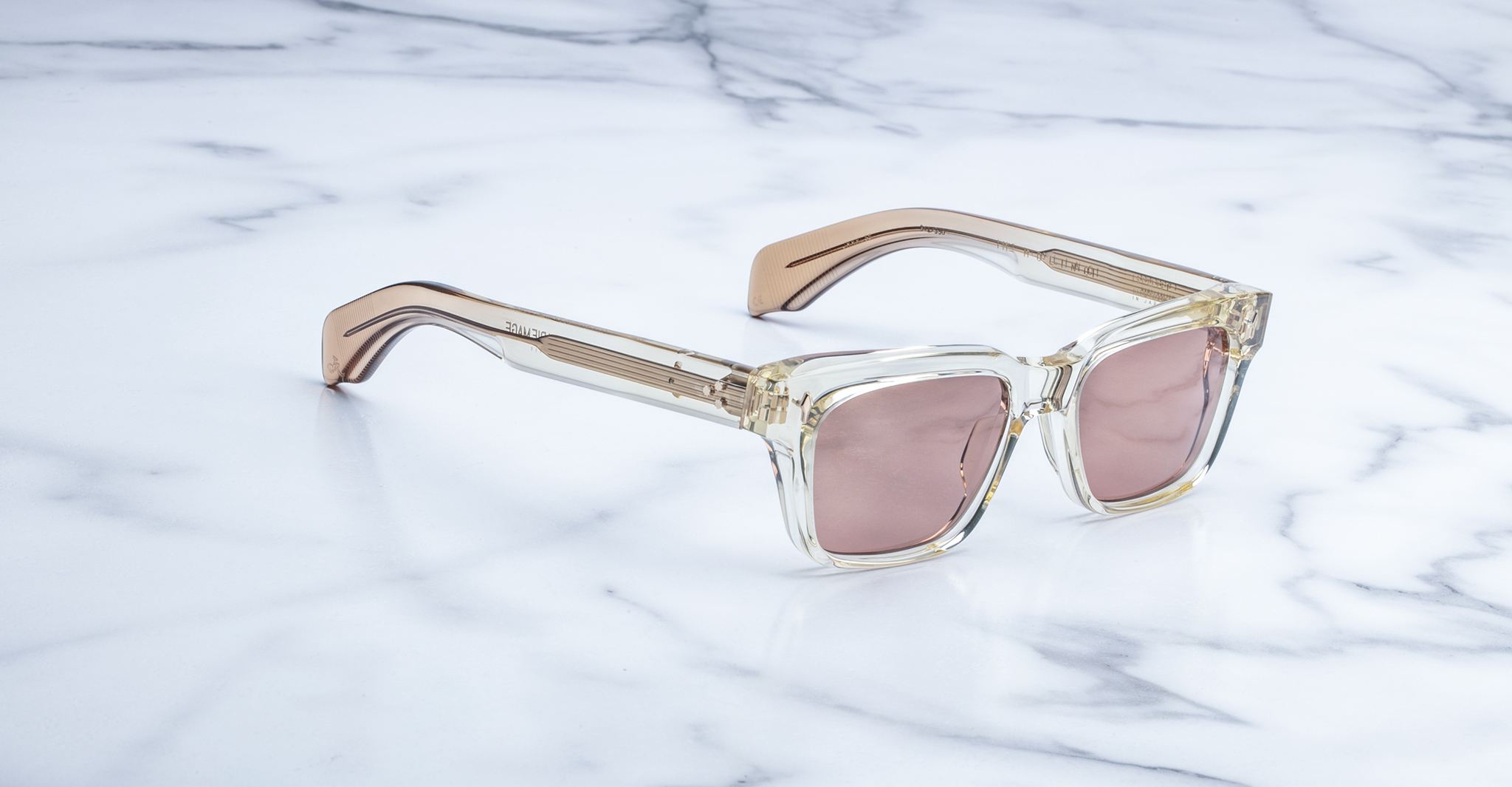 Jacques Marie Mage Molino square sunglasses with gold and clear arms, light pink lenses, front view.