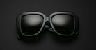 Jacques Marie Mage Gloria in black square frame sunglasses with dark lenses, front view.