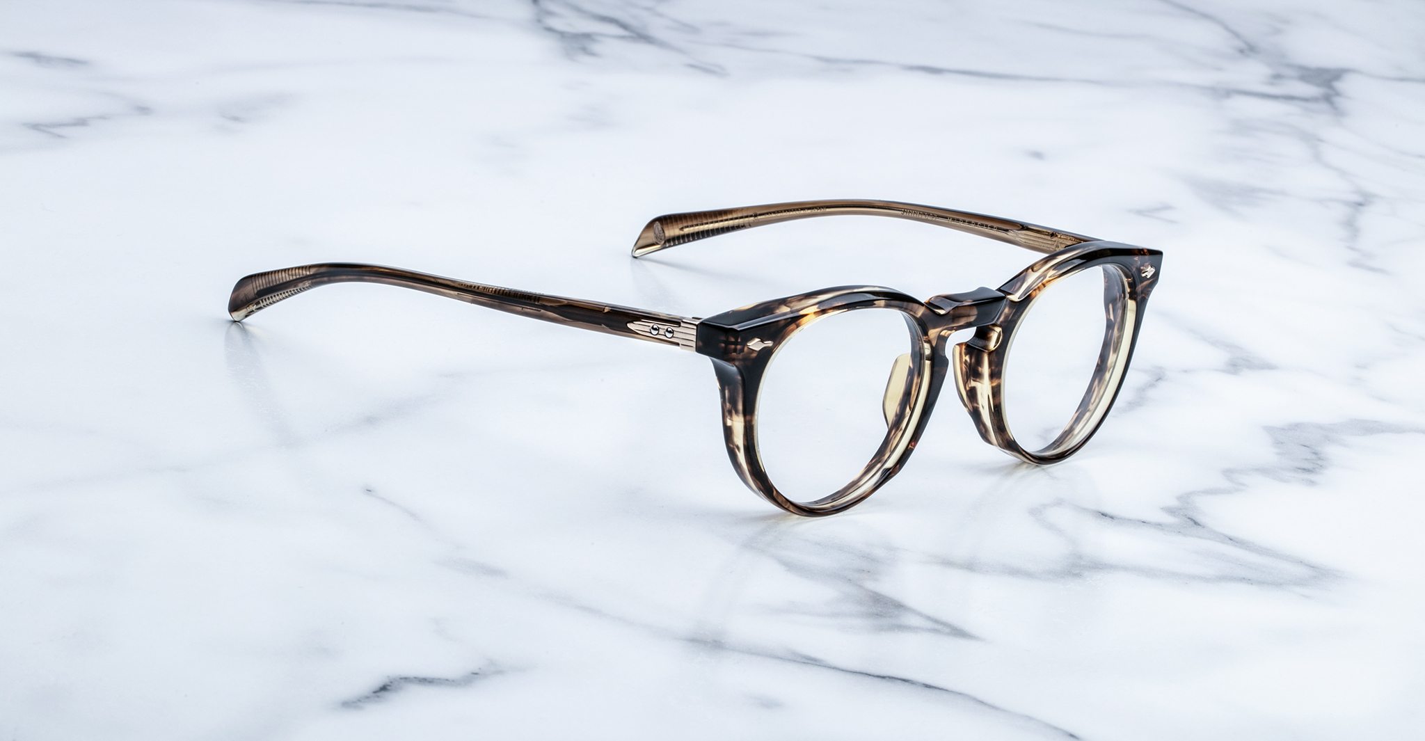 Jacques Marie Mage Percier round tortoiseshell eyeglasses shown from above, featuring signature design and brand detailing.