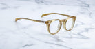 Jacques Marie Mage Percier eyeglasses, front view, by Jacques Marie Mage placed on a white marble surface.