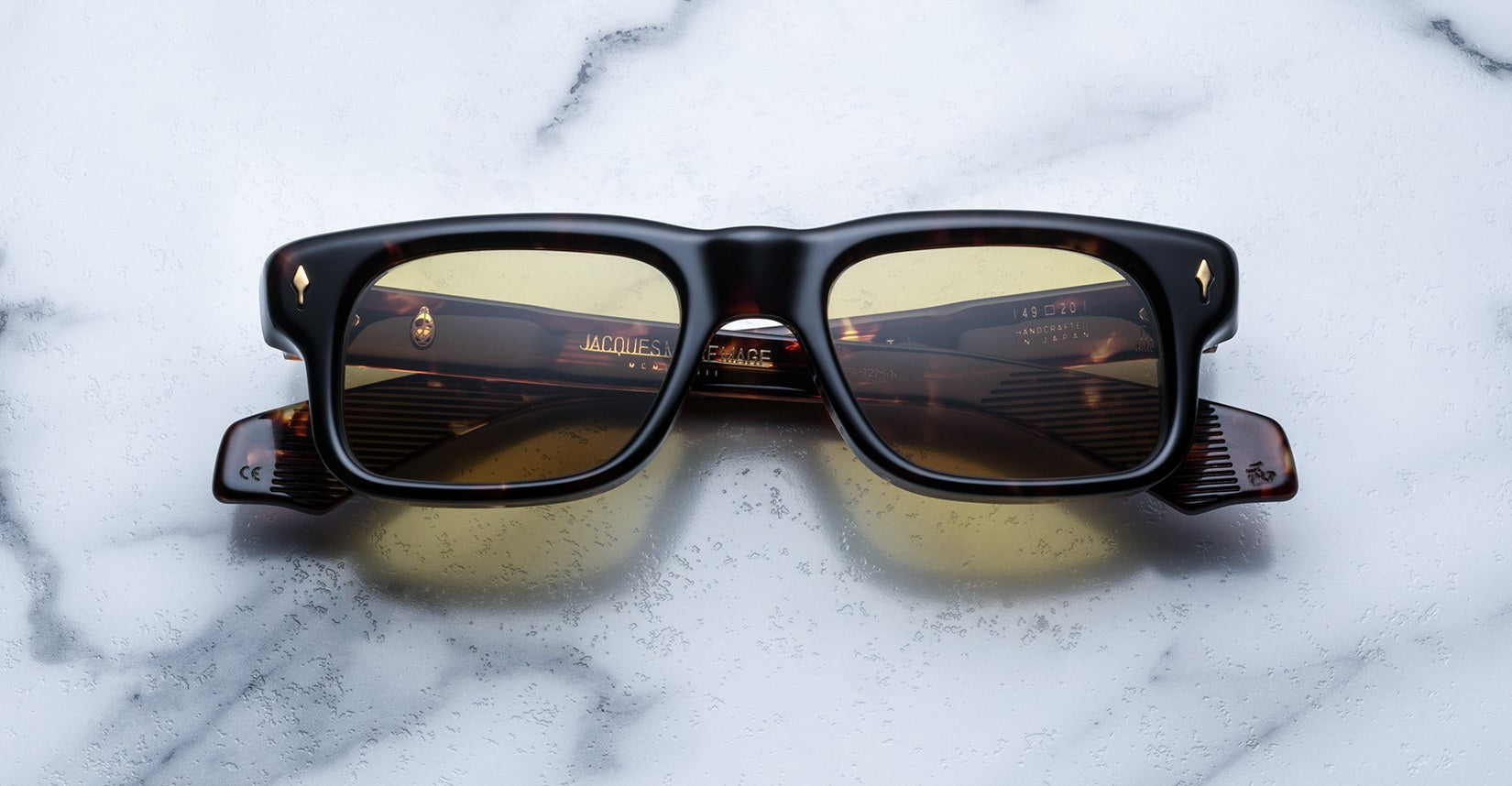 Jacques Marie Mage Saint rectangular tortoiseshell sunglasses with yellow lenses, top view.