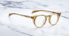 Jacques Marie Mage Sheridan in Marigold, warm amber acetate frame with modified Boston lens shape and keyhole bridge, front angled view