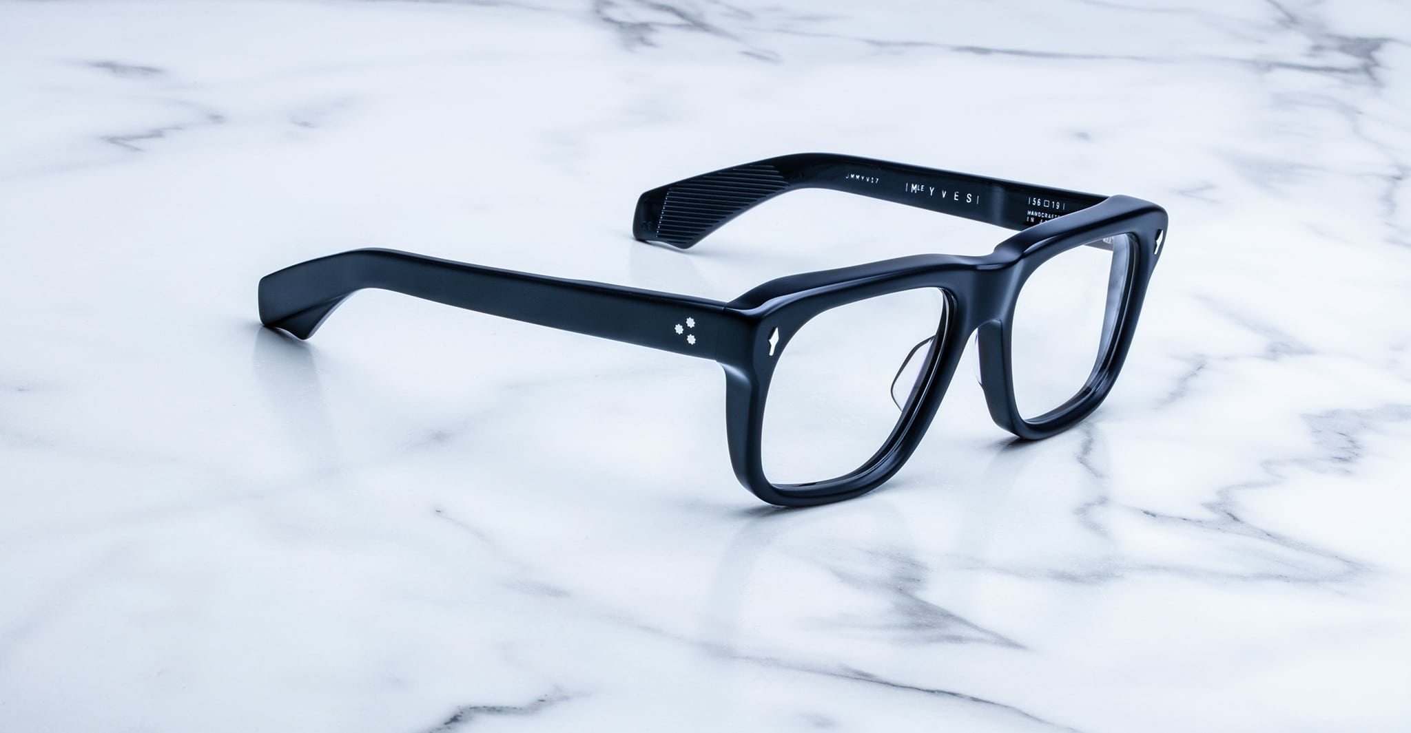 Jacques Marie Mage Yves black rectangular eyeglasses with clear lenses, front view.