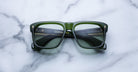 Jacques Marie Mage Yves green square-framed eyeglasses with tinted lenses, top view.