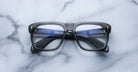 Jacques Marie Mage Yves rectangular eyeglasses with dark frames, top view.