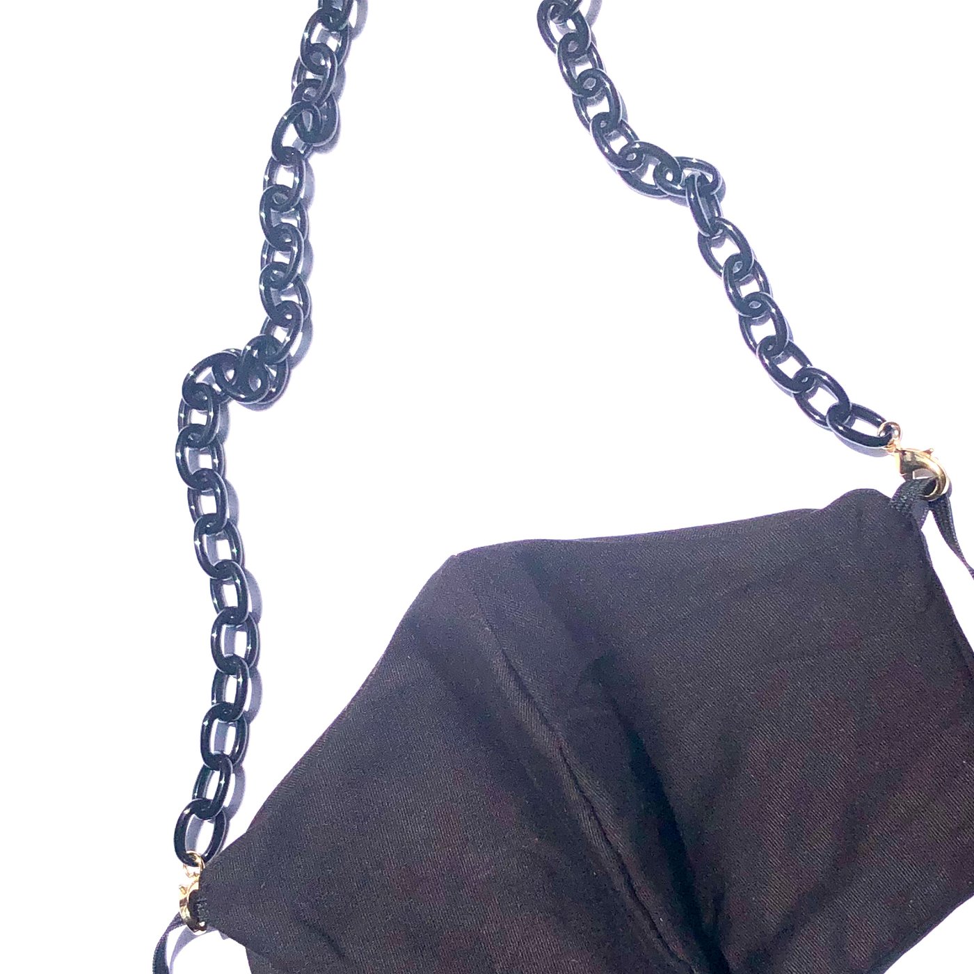 A close-up of a Small Link Necklace Chain for Face Masks, shown as a chunky black accessory on a black fabric purse, doubling as a stylish and functional mask chain, against a white background.