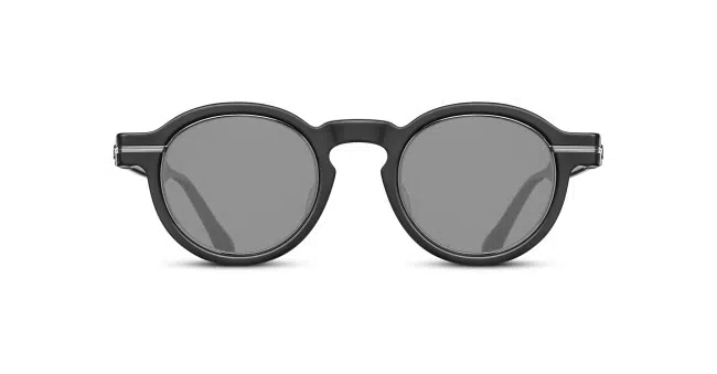 The Matsuda M2050 features round black sunglasses with thick frames and dark lenses, displayed from the front on a white background.