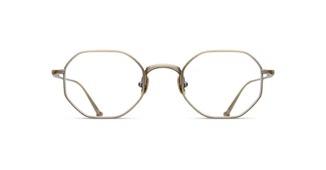 Front view of the Matsuda M3086 eyeglasses featuring thin gold metal frames and distinctive octagonal lenses, set against a white background.