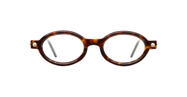 The Kuboraum P6 features round, tortoiseshell eyeglass frames with clear lenses and thin arms, shown on a white background.
