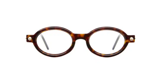 The Kuboraum P6 features round, tortoiseshell eyeglass frames with clear lenses and thin arms, shown on a white background.