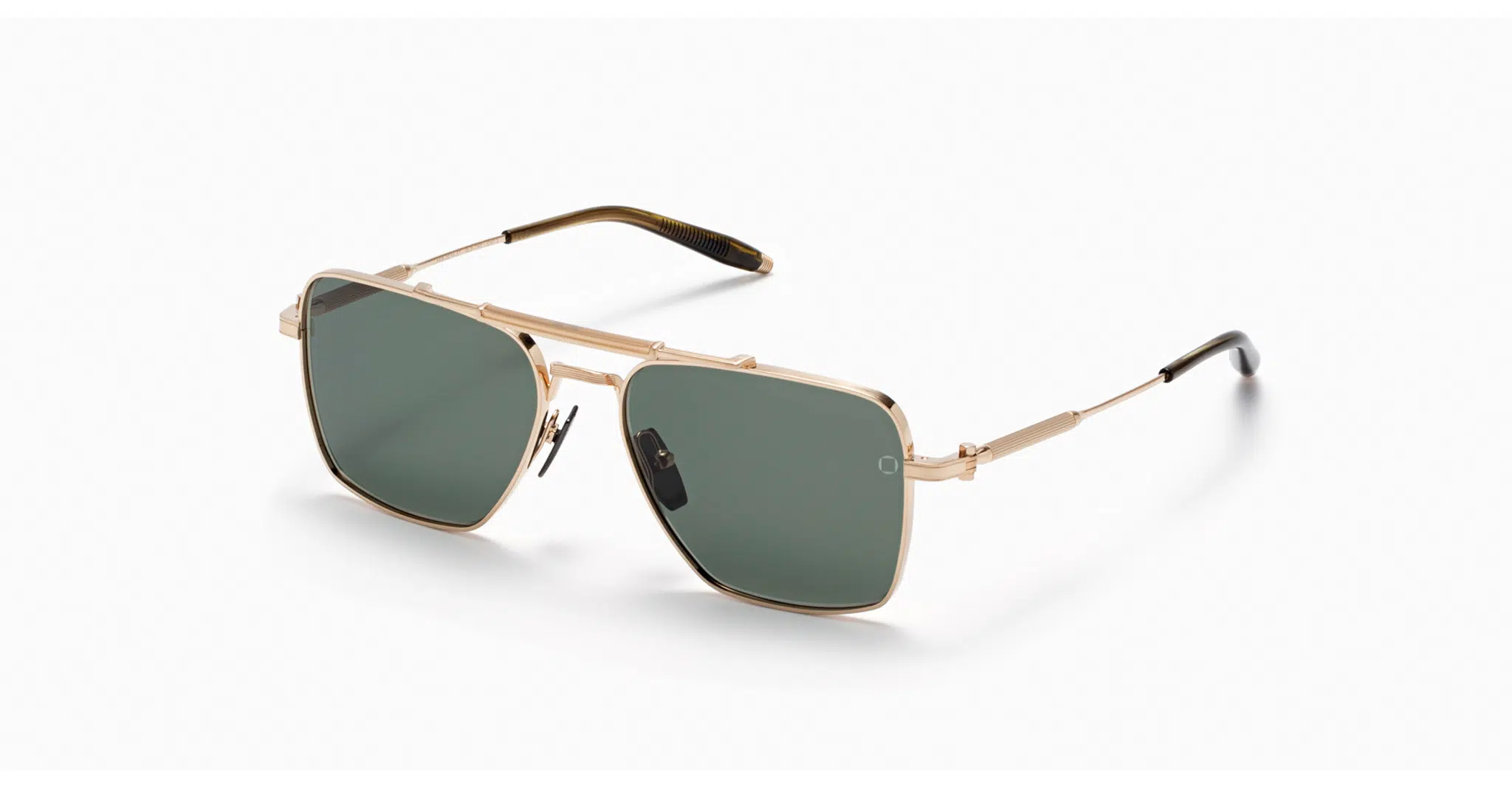 Akoni EOS in Brushed White Gold The Akoni Eos sunglasses feature a rectangular shape with thin gold metal frames, dark green lenses, and black-tipped arms, displayed against a white background.