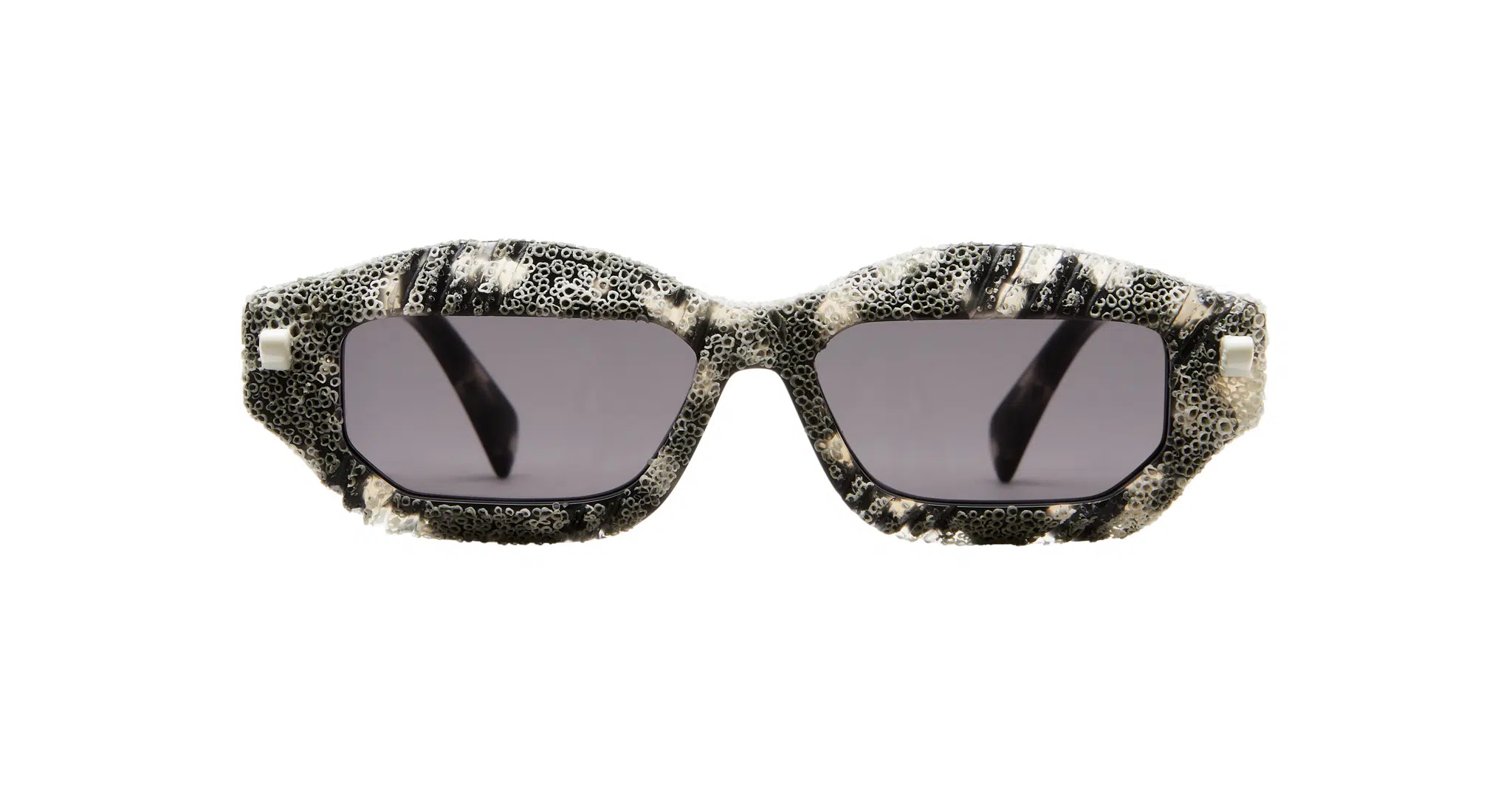 Kuboraum-Q6-HG-WC-White-Coral-KRS0Q6HG00WC252Y-Front-Dan-Deutsch Kuboraum Q6 rectangular sunglasses feature thick, textured black and white marbled frames with dark tinted lenses, displayed against a white background.