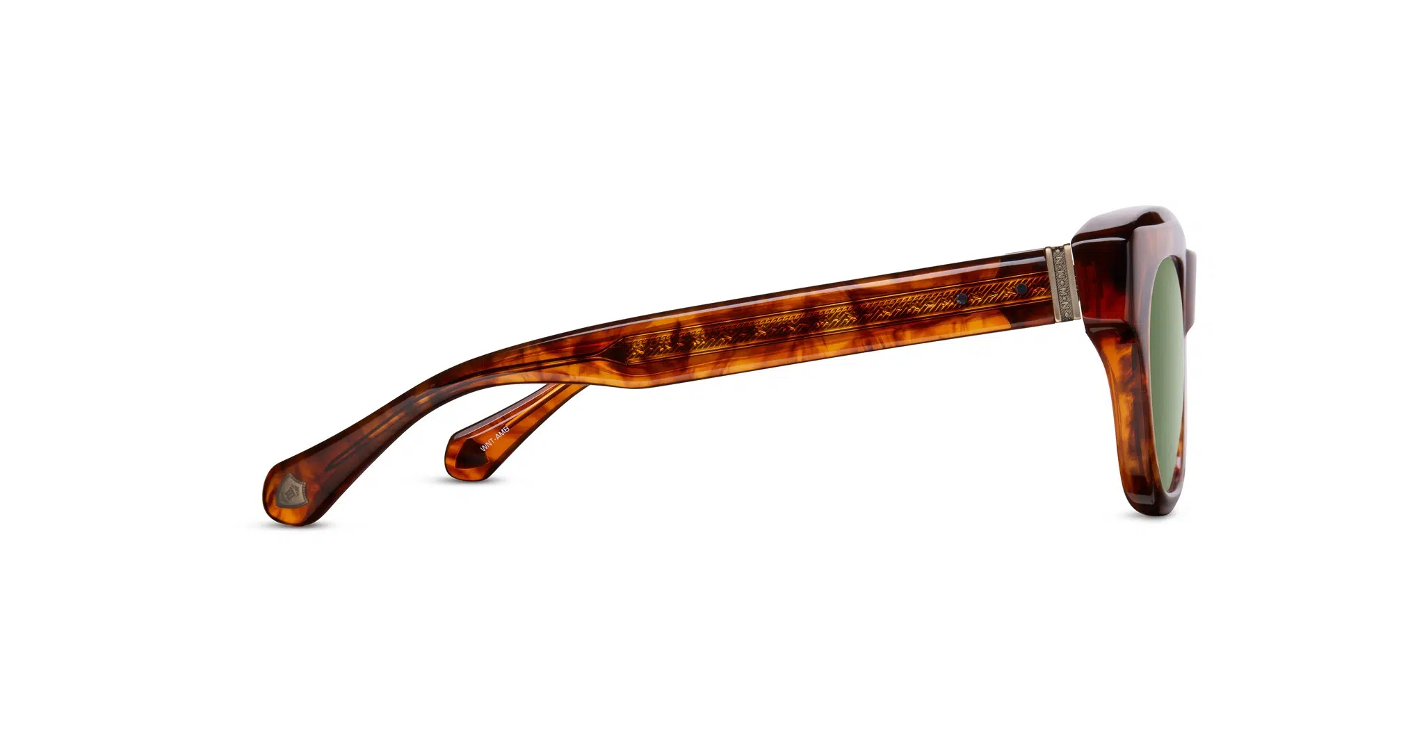 Side view of Matsuda M1027 sunglasses with a tortoiseshell-patterned frame and green-tinted lenses, highlighting the detailed arm and hinge design against a white background.