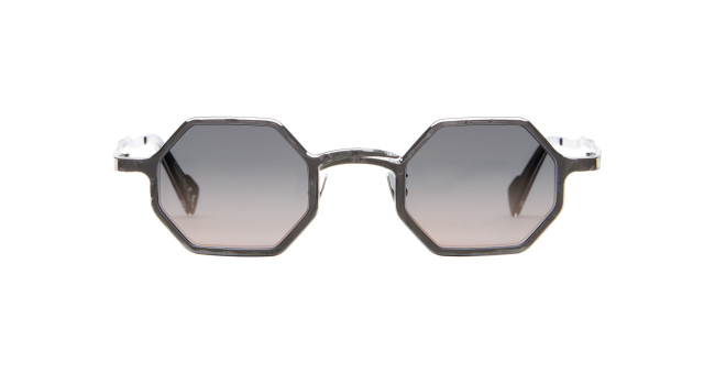 Front view of Kuboraum Z19 geometric hexagonal sunglasses with dark gradient lenses and transparent gray frames, displayed on a white background.