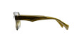Side view of Kuboraum K33 eyeglasses featuring thick, transparent brown-yellow frames and wide arms, shown on a white background.