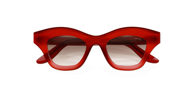 Lapima Tessa Petit red, thick-framed cat-eye sunglasses with slightly tinted lenses, shown from the front against a white background.