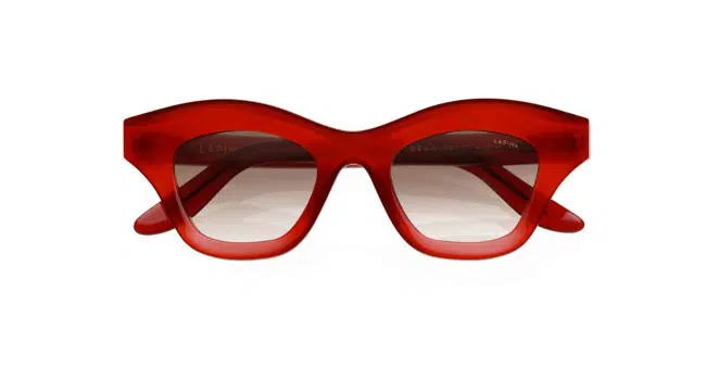 Lapima Tessa Petit red, thick-framed cat-eye sunglasses with slightly tinted lenses, shown from the front against a white background.