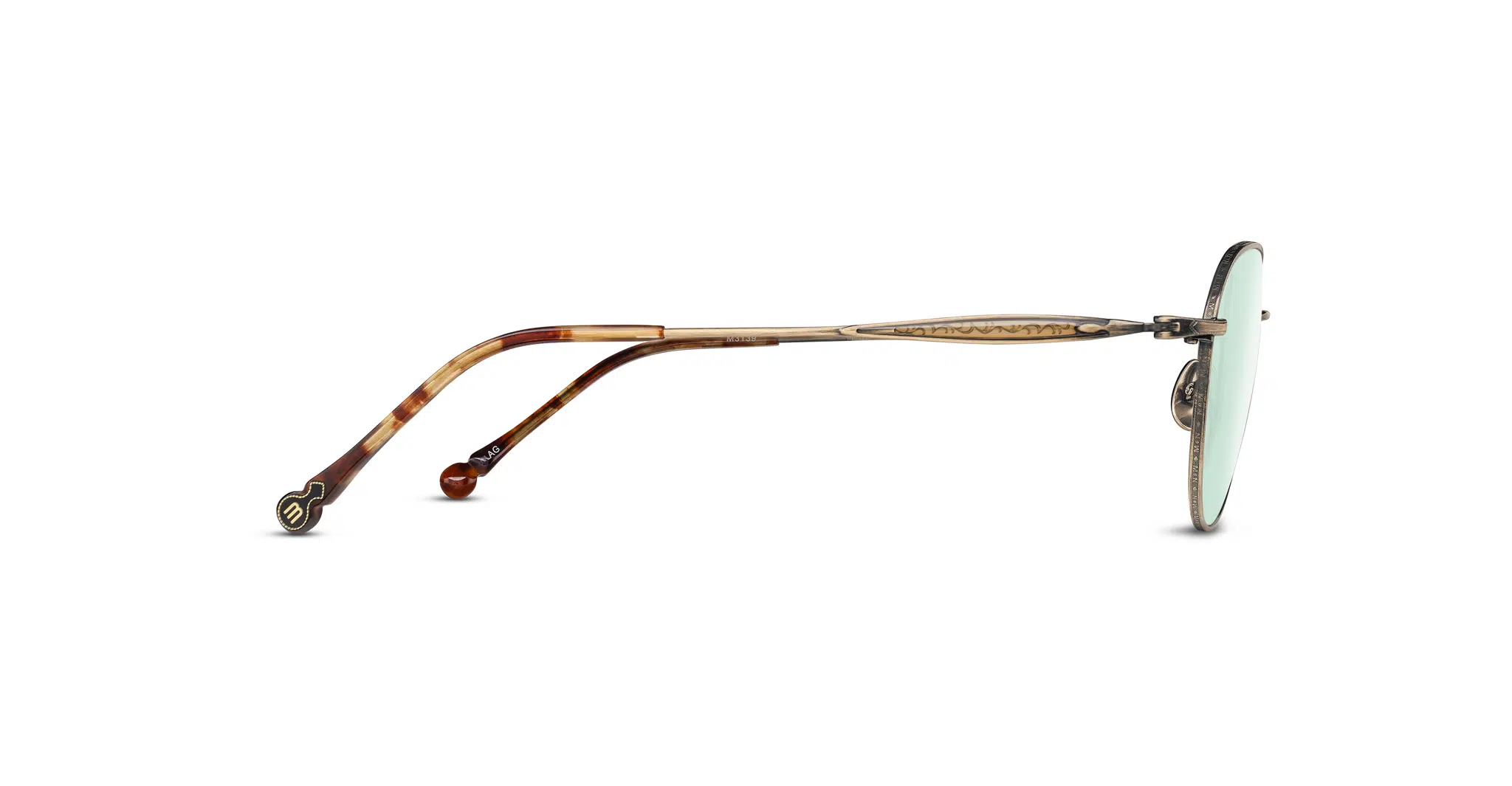 Side view of Matsuda M3139 round sunglasses with a thin, ornate gold metal frame, green-tinted lenses, and brown tortoiseshell-patterned temple arms on a white background.