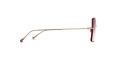 Side view of Matsuda M5005 sunglasses featuring thin gold metal arms and red-tinted rectangular lenses, set against a white background.