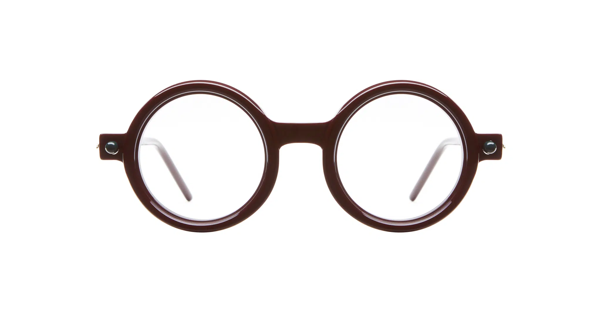 Kuboraum-P1-Bordeaux-KRO0P1DR000000OP-Front-Dan-Deutsch Kuboraum P1 round brown eyeglasses with clear lenses and a thick frame, shown front-facing against a white background.