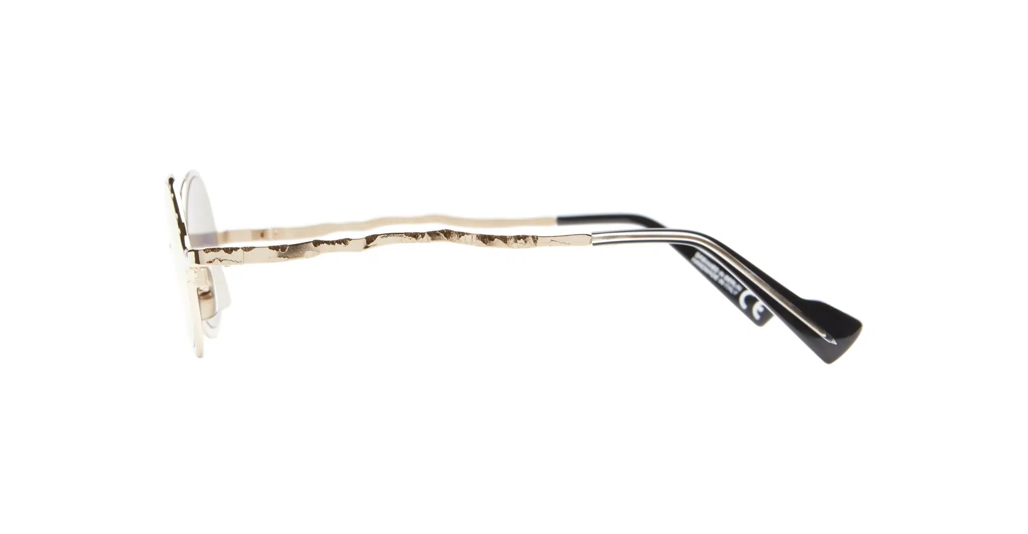 Side view of Kuboraum Z17 eyeglasses featuring a gold, textured metal frame and black temple tips, set against a white background.