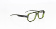 A pair of Jacques Marie Mage Evans rectangular eyeglasses with thick, translucent green frames and black arms rests on a white surface. The temples feature two small silver dots near the hinges.