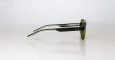 The Jacques Marie Mage Evans eyeglasses, featuring green frames and transparent temples, are displayed on a white surface and viewed from the side.