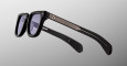 The Jacques Marie Mage Vendome sunglasses feature black frames with dark lenses, silver accents on the arms, and subtle horizontal grooves near the hinges, displayed against a light gray background.