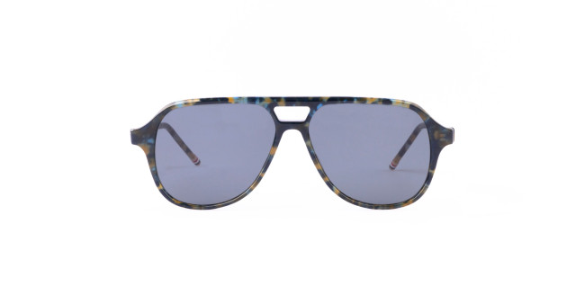 A pair of Thom Browne aviator sunglasses with blue-tinted lenses and a multicolored, tortoiseshell-style frame. The design features a straight top edge and a small cutout above the nose bridge.