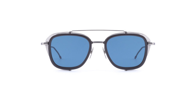 A pair of Thom Browne sunglasses with a black frame, blue-tinted lenses, and a thin metal double bridge, shown facing forward on a white background.