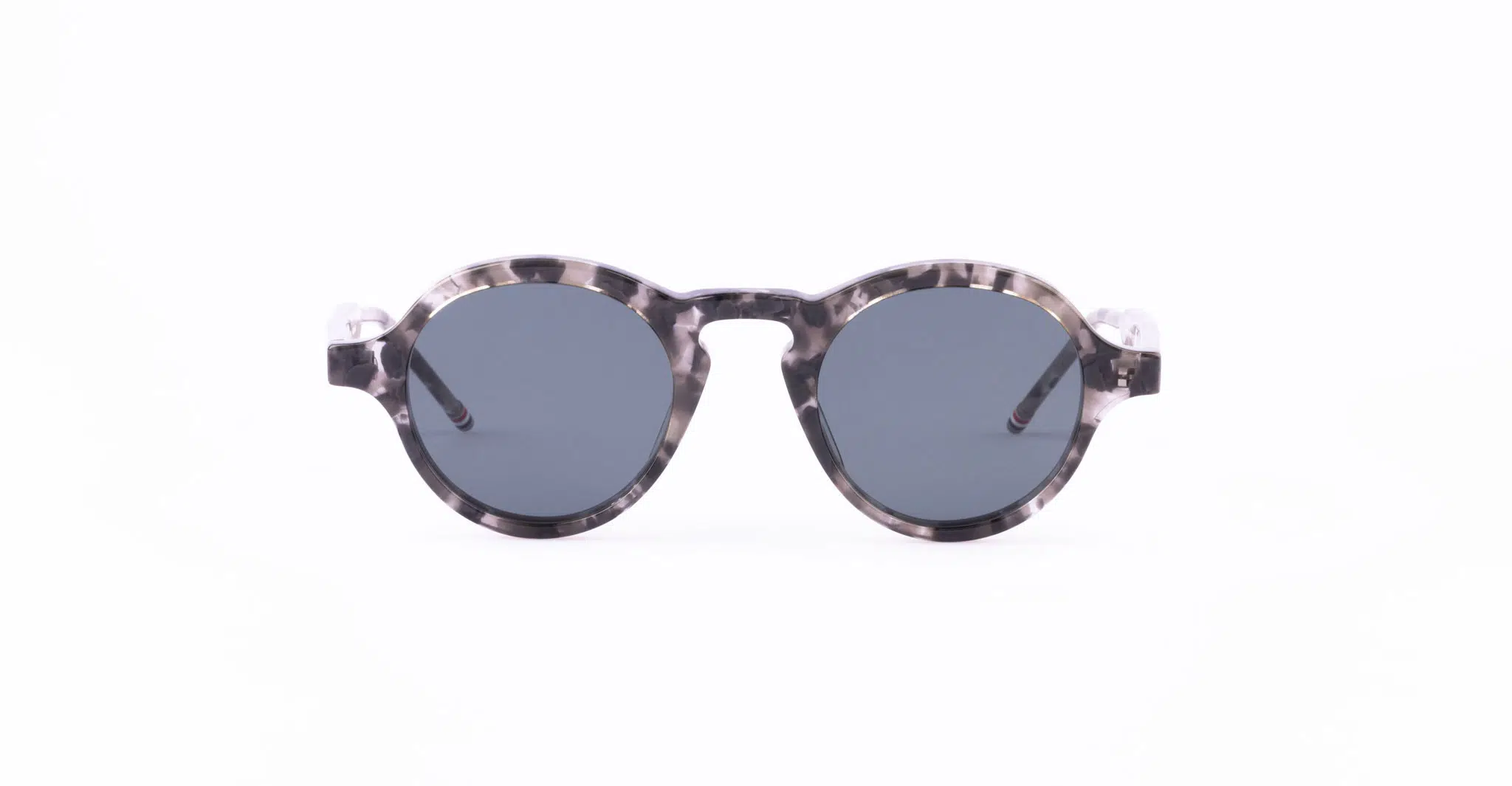 Thom Browne 926 round sunglasses with dark lenses and a marbled gray and black patterned frame, displayed on a plain white background.