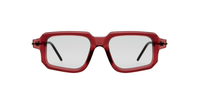 Kuboraum P23 bold square eyeglasses feature translucent red frames and clear lenses, seen from the front. The black temples are partially visible.
