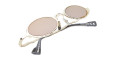 The Kuboraum Z24 is a pair of gold-framed, round sunglasses with brown tinted lenses, shown folded on a white background. White product details are visible on the arms of the glasses.