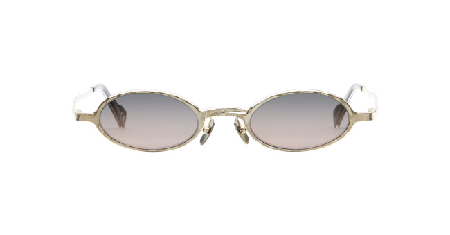 The Kuboraum Z24 sunglasses feature round gold frames and gradient lenses that fade from dark at the top to lighter at the bottom, shown on a white background.