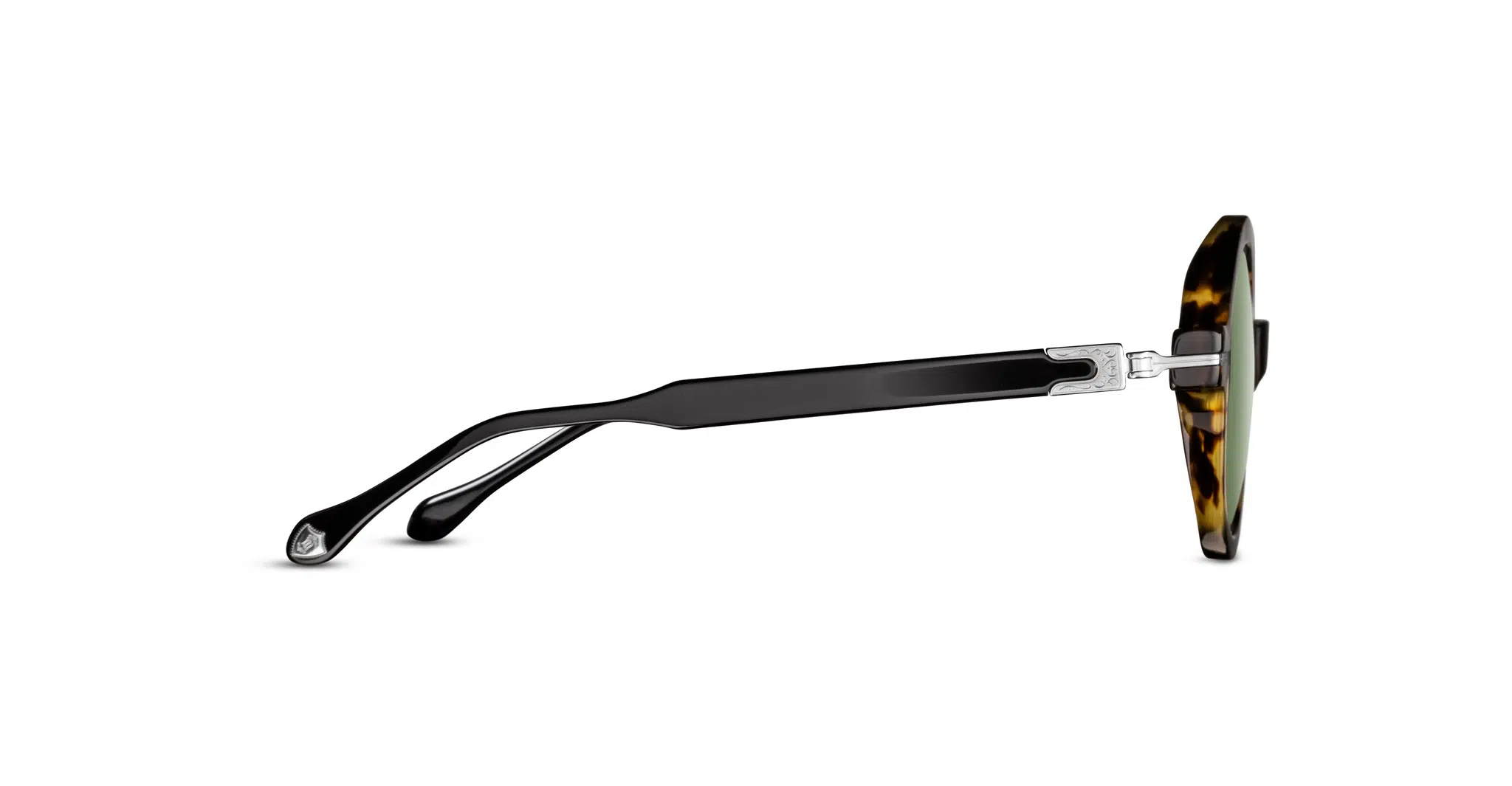 Side view of Matsuda M2059 sunglasses featuring a tortoiseshell frame, green-tinted lenses, and black curved arms with metal hinge detailing.