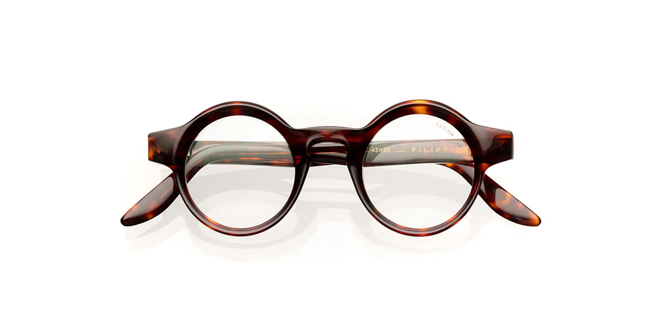 A pair of round, tortoiseshell eyeglasses with thick frames and clear lenses, displayed on a white background.