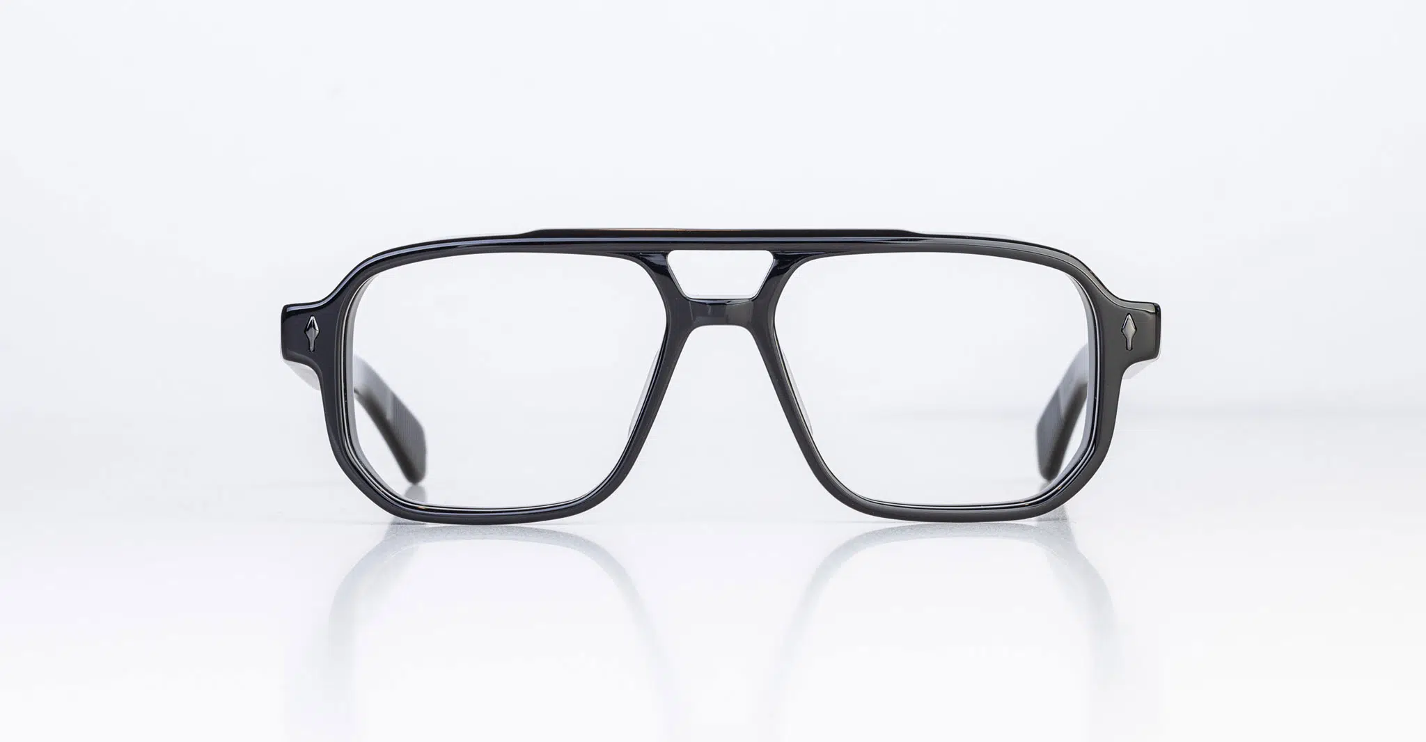 The Jacques Marie Mage Evans is a pair of black rectangular eyeglasses with thick frames, displayed facing forward on a white background.
