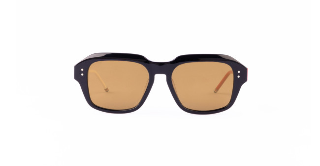 A pair of Thom Browne 928 sunglasses with thick, black geometric navy frames and brown-tinted lenses is shown against a plain white background.
