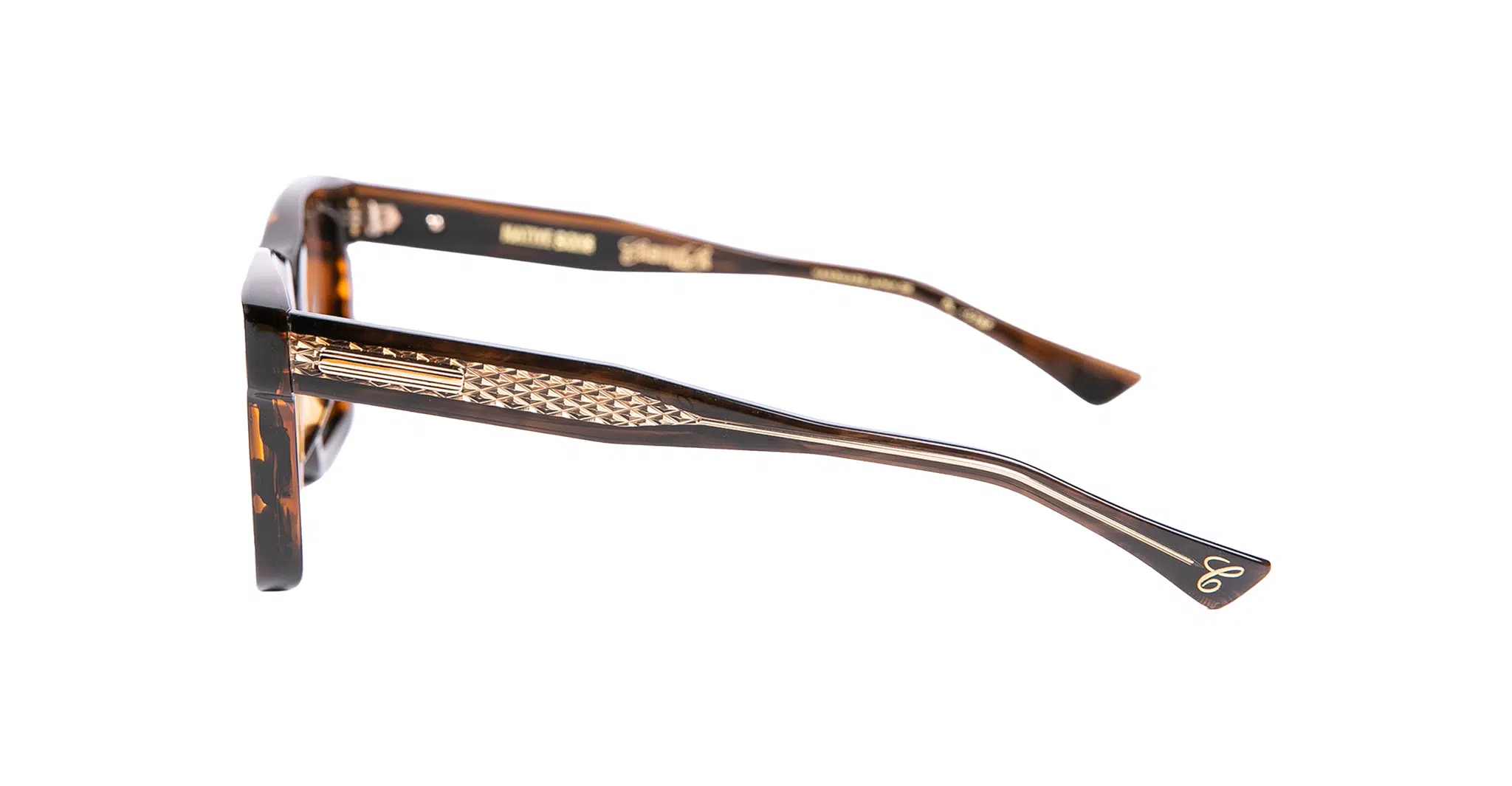 Native Sons x Casinola The Eddie aka "The E's" eyeglasses feature a tortoiseshell pattern with gold details and textured metal accents on the temples, shown in a side view against a white background.