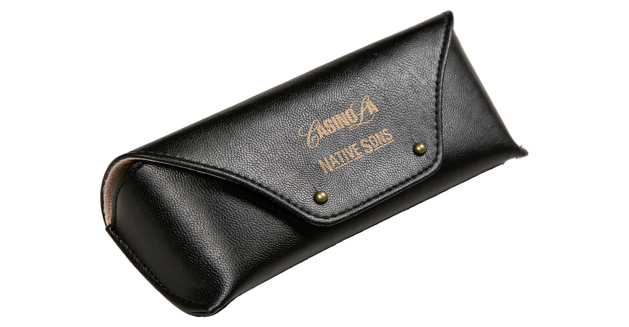 A Native Sons x Casinola "The E's" black leather eyeglass case features gold text and decorative flap markings, secured by two metal rivets, shown against a white background.