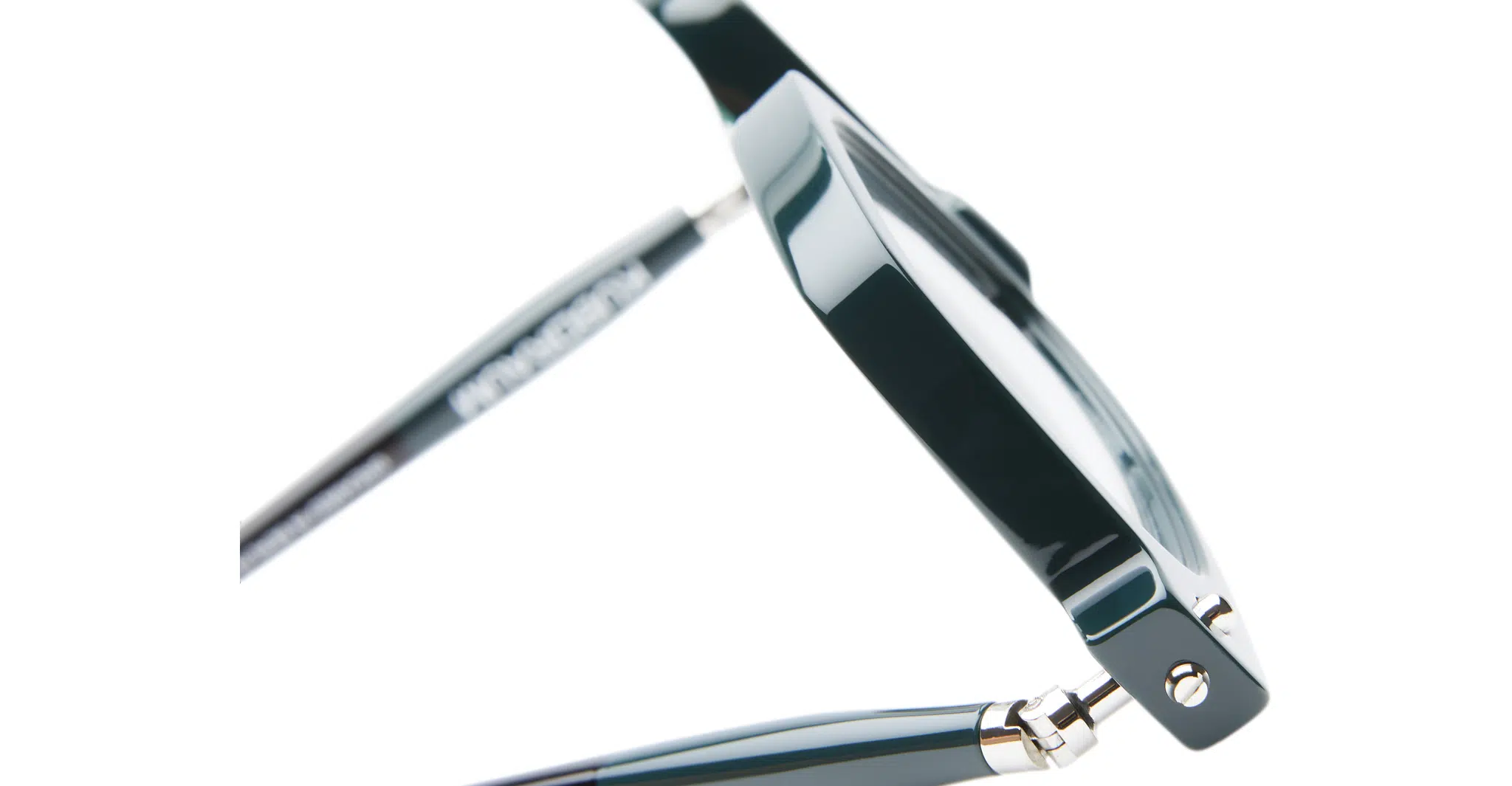 Close-up side view of Kuboraum P25 dark green eyeglass frames with a metal hinge detail, highlighting the glossy finish and part of the temple arm against a white background.