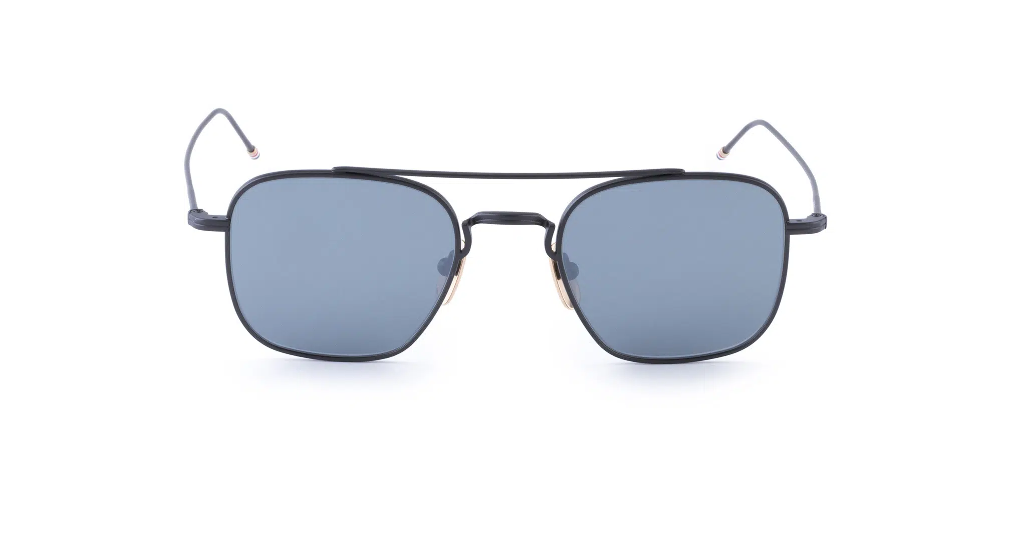 Front view of Thom Browne Sunglasses featuring square, blue-tinted lenses and a thin black metal frame. The slim temples curve slightly at the ends, complemented by a double bridge above the nose pads.