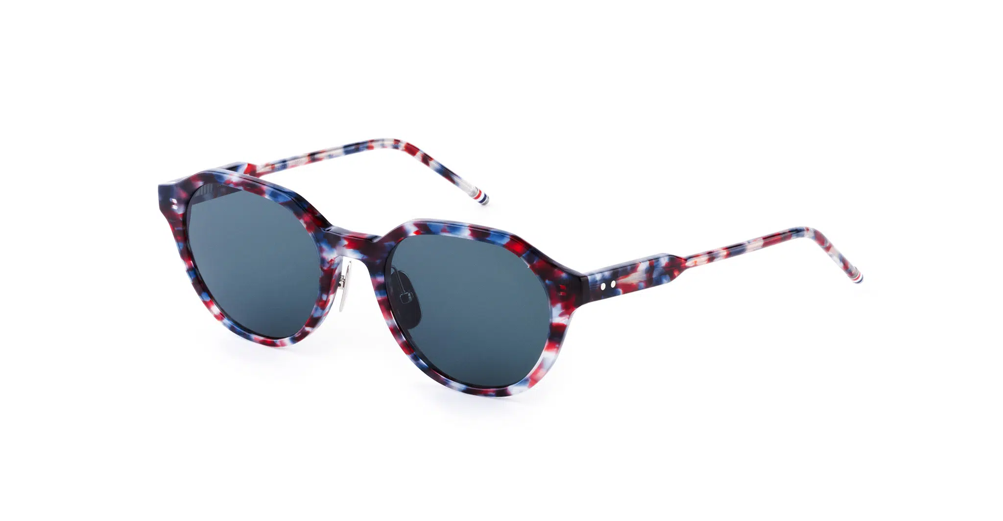 Round Thom Browne Sunglasses with dark lenses and a red, white, and blue tortoiseshell-patterned frame